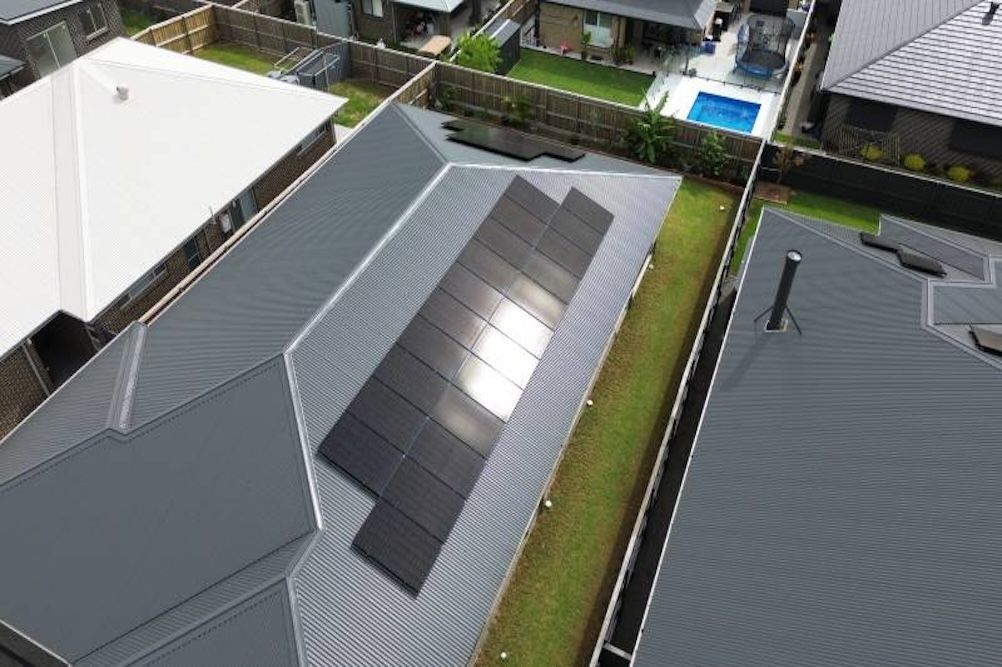 Podium Solar installers working on a roof